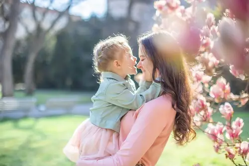 Mother and child in spring blossoms